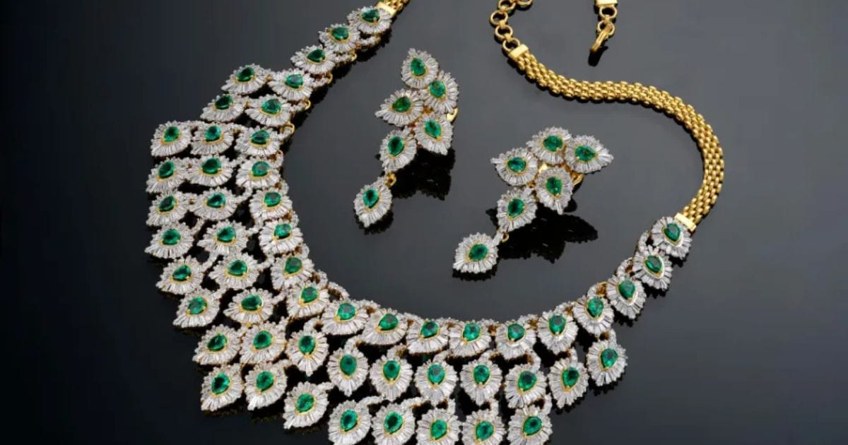 A stunning set of diamond jewellery featuring emerald accents, available for purchase online.