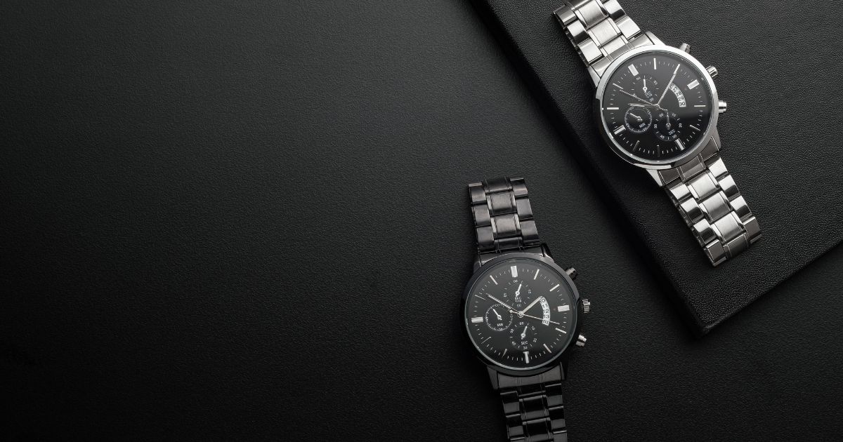 Premium designer watches for men and women in black and silver with chronograph dial on black background.