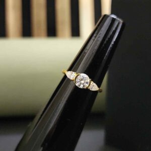 Elegant Three Stone Round And Pear Cut Diamond Ring